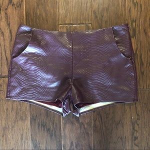 Dark purple faux leather snake embossed shorts